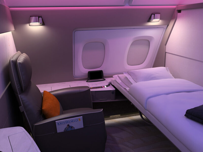 Singapore Airlines A380 First Class suite row on upper deck with sliding doors and leather armchairs