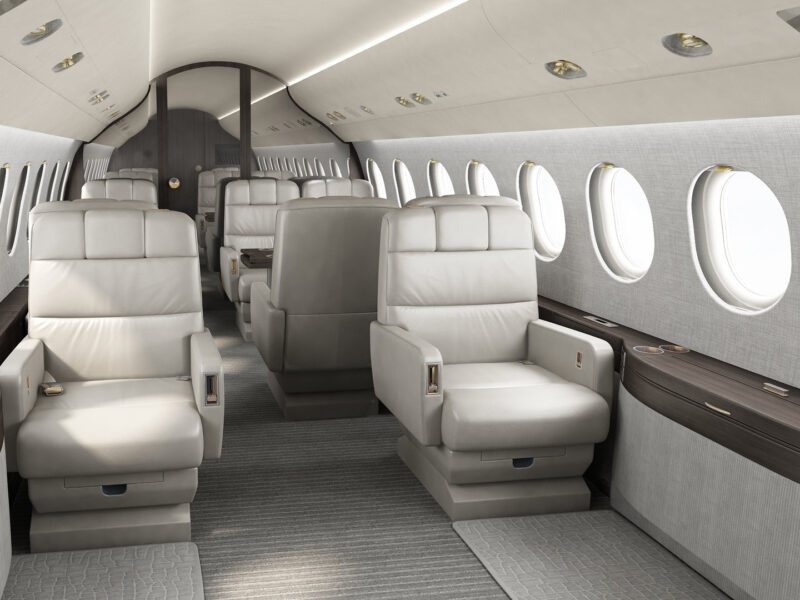 Photorealistic rendering of Dassault Falcon 2000 private jet cabin interior with luxurious seating and ambient lighting.